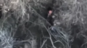 An alleged cartel member aiming at an American drone. @LtChrisOlivarez/X