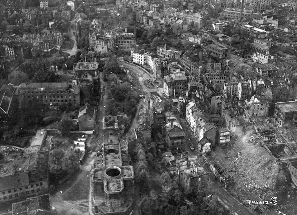 The domeless cathedral where Charlemagne was crowned Emperor of the Holy Roman Empire centuries earlier is visible in this aerial view of a devastated Aachen taken on October 24, 1944. Hitler was particularly insistent that Aachen be brutally defended since the city was in Germany and was significant in the nation’s history. | National Archives
