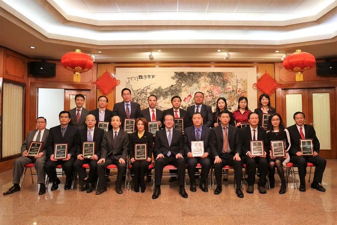 Dr. Yan (back row, fourth from left) holding his consular protection liaison officer certificate.