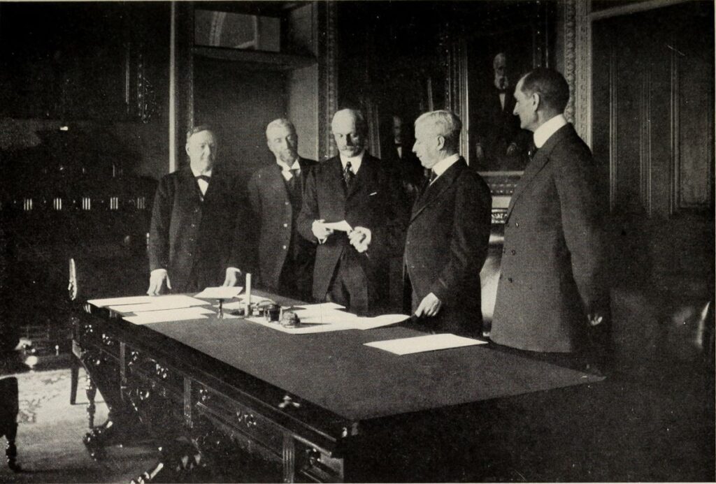 Ambassador Constantin Brun receives a check for $25 million, finalizing the sale of the Danish West Indies to the United States, March 31, 1917. | Public Domain