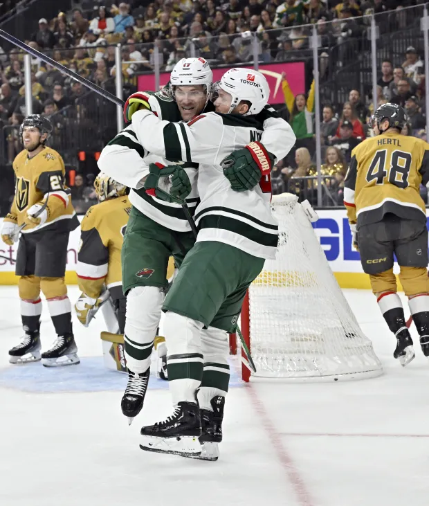 Minnesota Wild left wing Marcus Foligno, left, and center Gustav Nyquist (41) celebrate Foligno’s goal against the Vegas Golden Knights during the first period of Game 2 of a first-round NHL hockey playoff series Tuesday, April 22, 2025, in Las Vegas. | AP Photo/David Becker