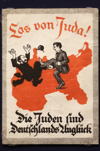 A sticker, circa 1900, reads: "Away with Juda! The Jews are Germany's disaster." Before local anti-Jewish laws were enacted, racist words and images were used to stoke the fires of hatred. | AP